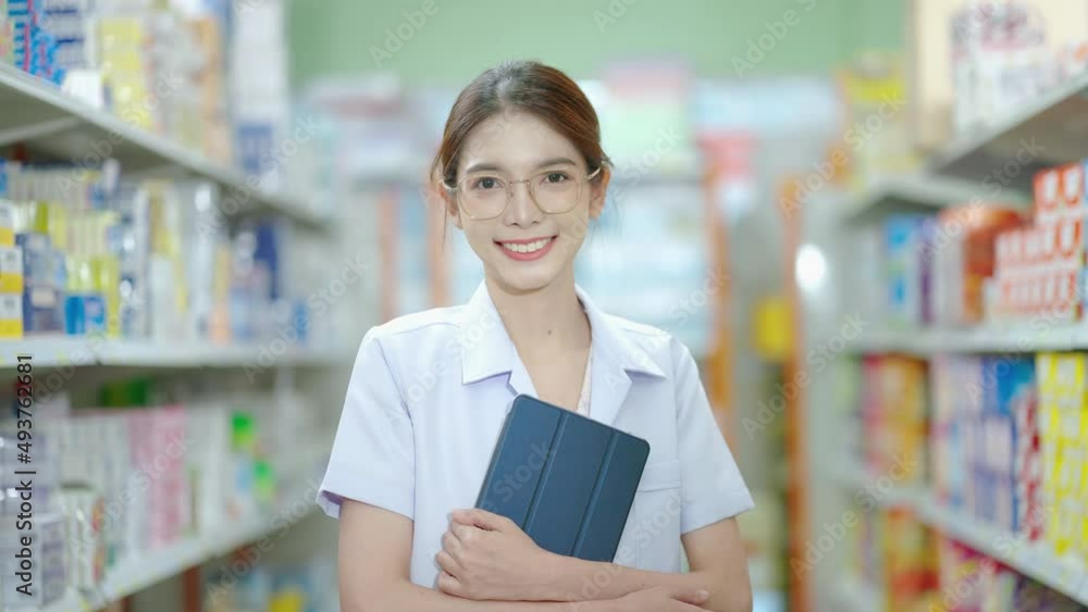 portrait, a beautiful Asian pharmacist is standing and smiling confidently in the pharmacy service.
portrait, a beautiful Asian pharmacist is standing and smiling confidently in the pharmacy service.
