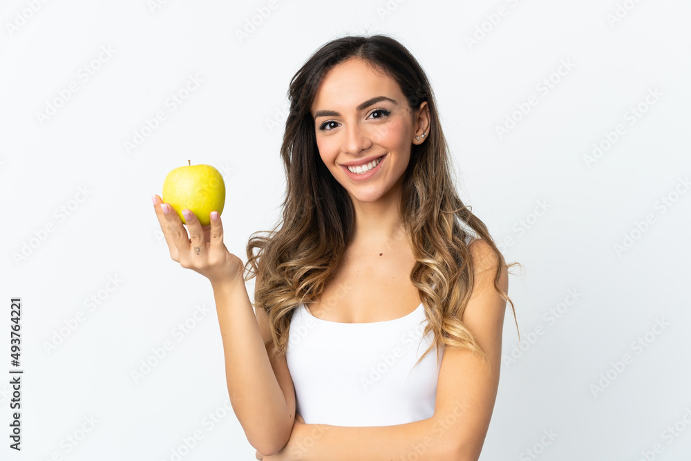 Young caucasian woman isolated on white background with an apple Young caucasian woman isolated on white background with an apple