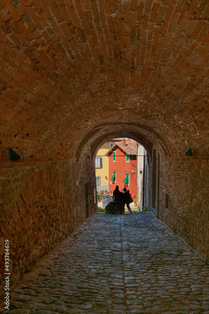 An ancient covered walkway in the historic center of Montecarlo, Lucca, Italy