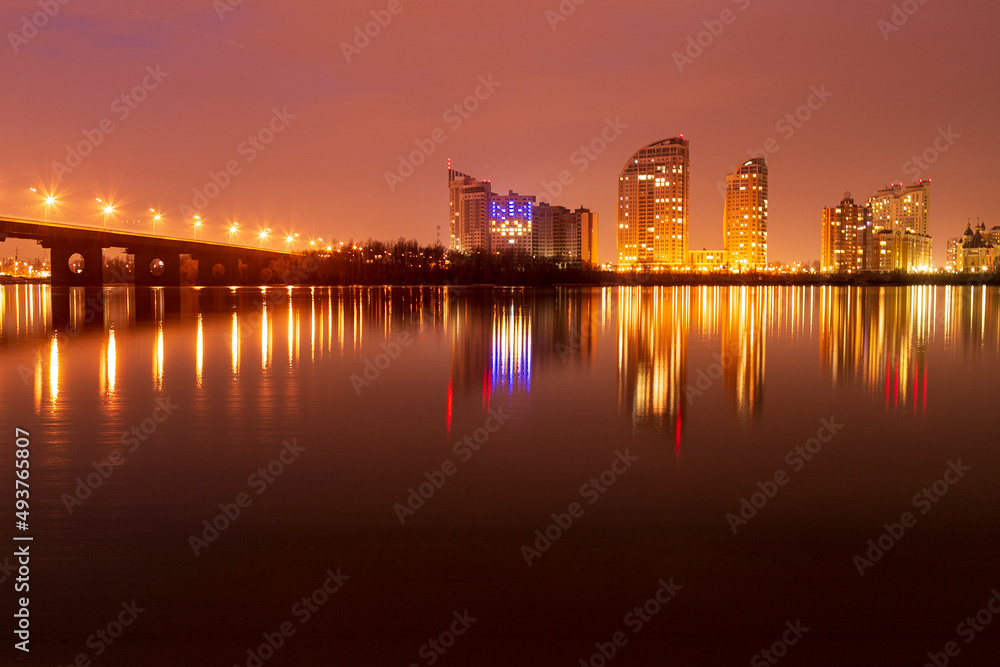 The Southern Bridge across the Dnieper in Kiev, the capital of Ukraine. Blue hour, sunset The Southern Bridge across the Dnieper in Kiev, the capital of Ukraine. Blue hour, sunset