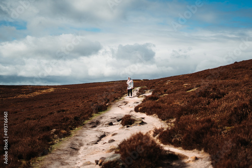 Person standing at the empty fields of Peak District National Park, England, UK