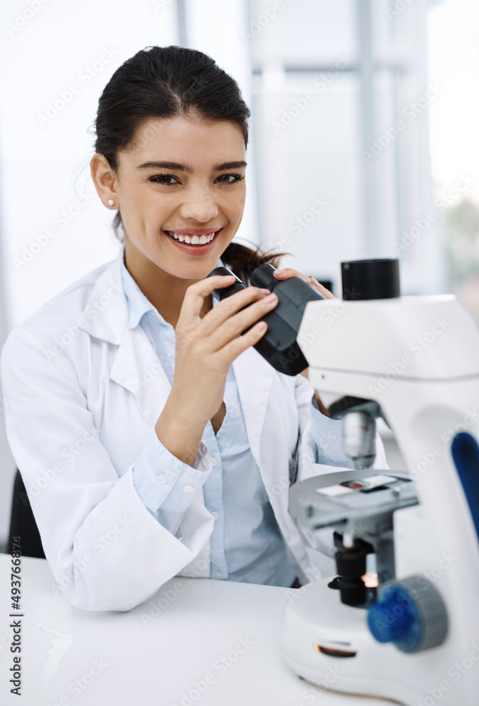 Ive always been curious about the world. Shot of a young scientist using a microscope in a lab. Ive always been curious about the world. Shot of a young scientist using a microscope in a lab.
