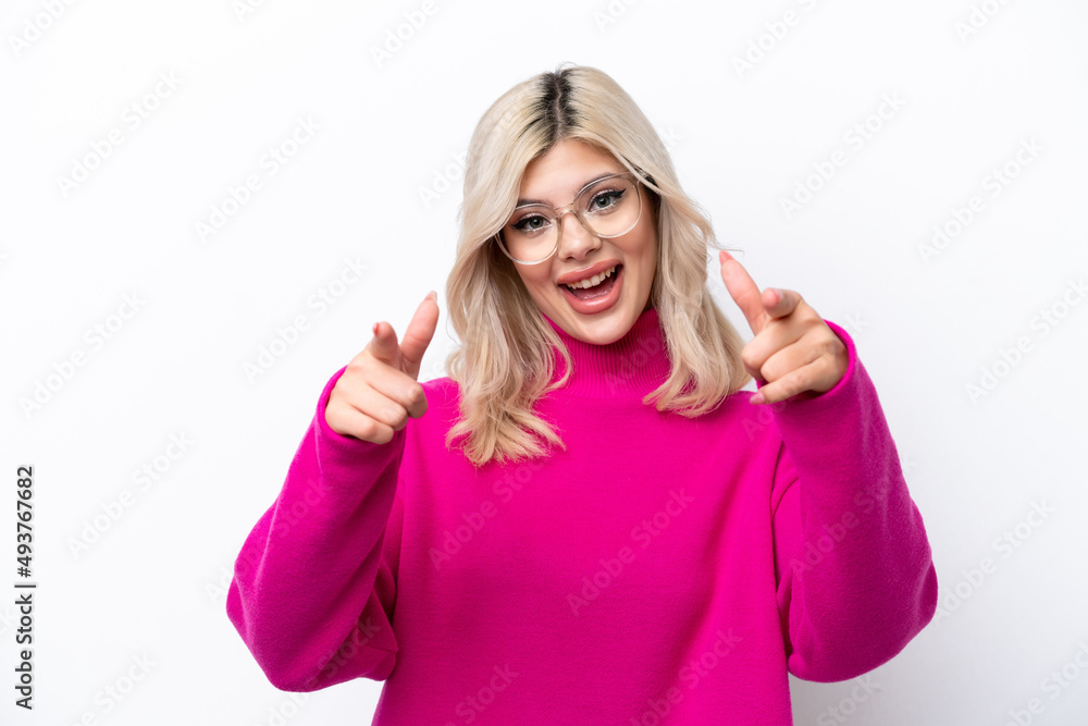 Young Russian woman isolated on white background surprised and pointing front Young Russian woman isolated on white background surprised and pointing front