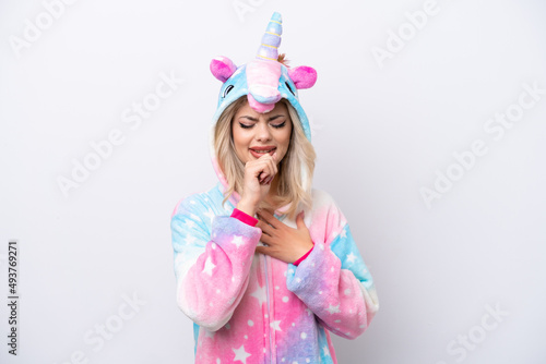 Young Russian woman with unicorn pajamas isolated on white background is suffering with cough and feeling bad