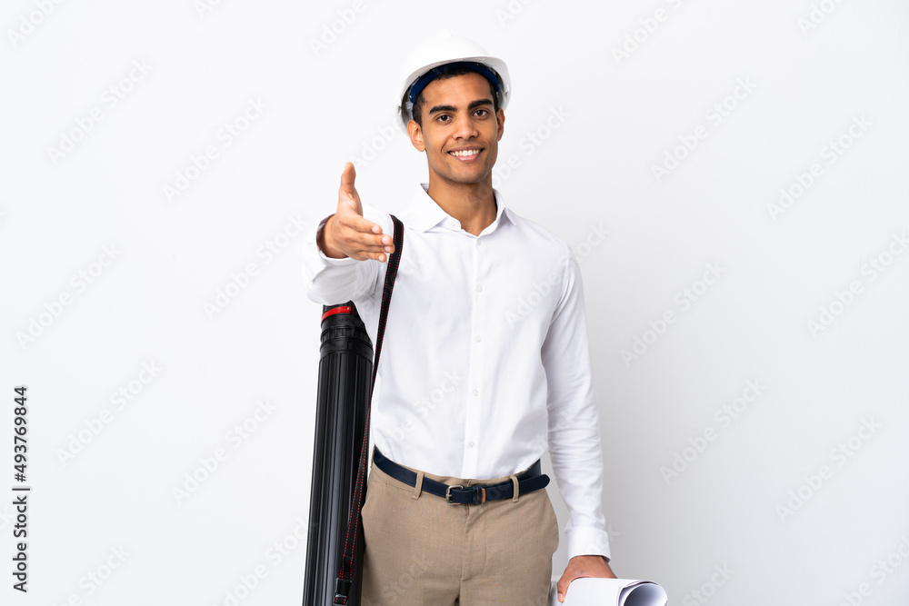 African American architect man with helmet and holding blueprints over isolated white background _ shaking hands for closing a good deal African American architect man with helmet and holding blueprints over isolated white background _ shaking hands for closing a good deal