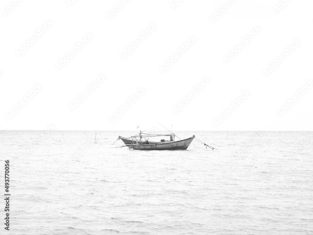 fishing boat in the sea in black and white fishing boat in the sea in black and white