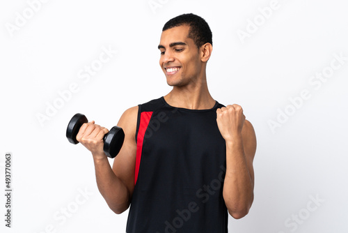 African American sport man over isolated white background celebrating a victory