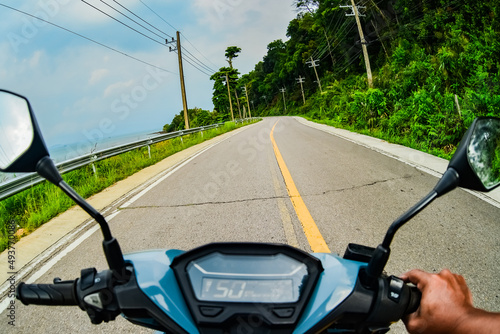 View of motorbike driving on the road in Thailand's Koh Chang