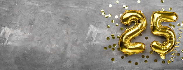 Yellow foil balloon number, number twenty-five on a concrete background. 25th birthday card. Anniversary concept. for anniversary, birthday, new year celebration. banner,