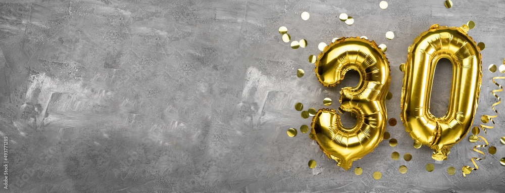 Yellow foil balloon number, number thirty on a concrete background. 30th birthday card. Anniversary concept. for anniversary, birthday, new year celebration. banner - obrazy, fototapety, plakaty 