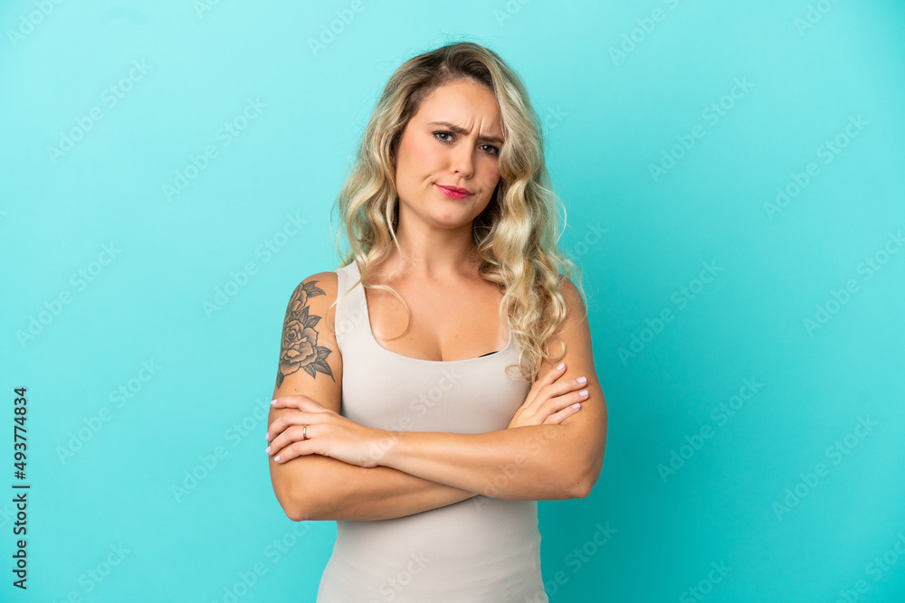 Young Brazilian woman isolated on blue background with unhappy expression Young Brazilian woman isolated on blue background with unhappy expression