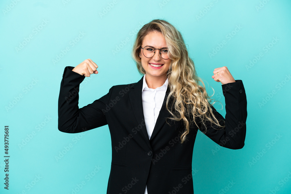 Brazilian business woman over isolated background doing strong gesture Brazilian business woman over isolated background doing strong gesture