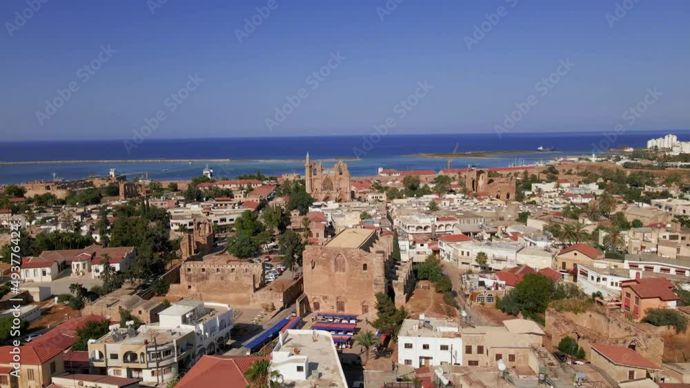 Aerial 4k Famagusta Walled City, old town and Varosha landscapes in North Cyprus surrounded with old streets, shops, touristic sightseeings, mosque, cathedral, castle with a sunny day in Cyprus. Aerial 4k Famagusta Walled City, old town and Varosha landscapes in North Cyprus surrounded with old streets, shops, touristic sightseeings, mosque, cathedral, castle with a sunny day in Cyprus.