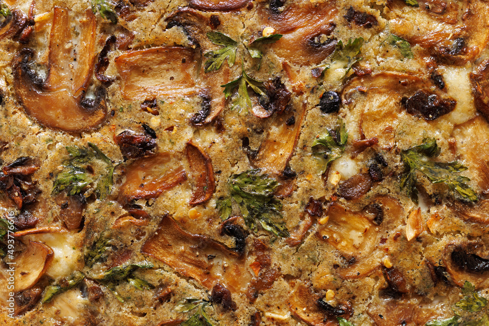 Close up of a mushroom quiche with visible ingredients