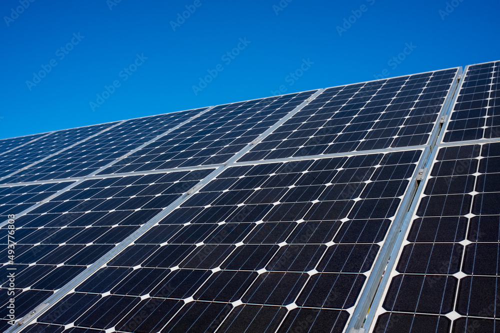 Solar panel of a solar park. Photovoltaic modules of a Solar energy power plant producing sustainable energy to prevent climate change.