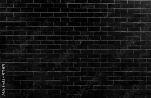 Black brick texture background. Abstract old brick wall surface as used for background, wallpaper and graphic web design