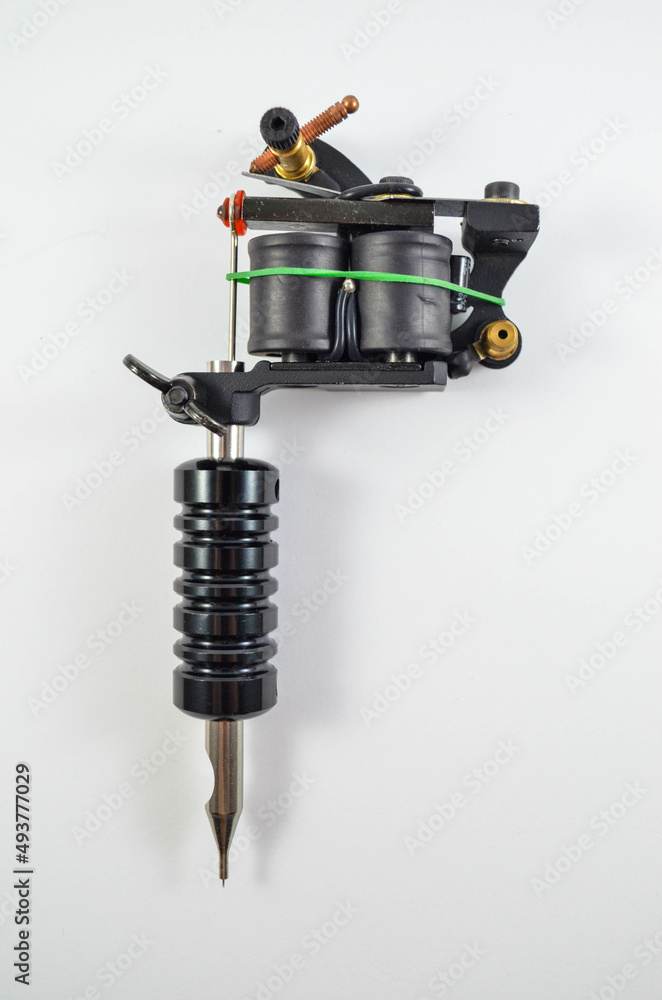 Black Coil Tattoo Gun On The White Background Black Coil Tattoo Gun On The White Background