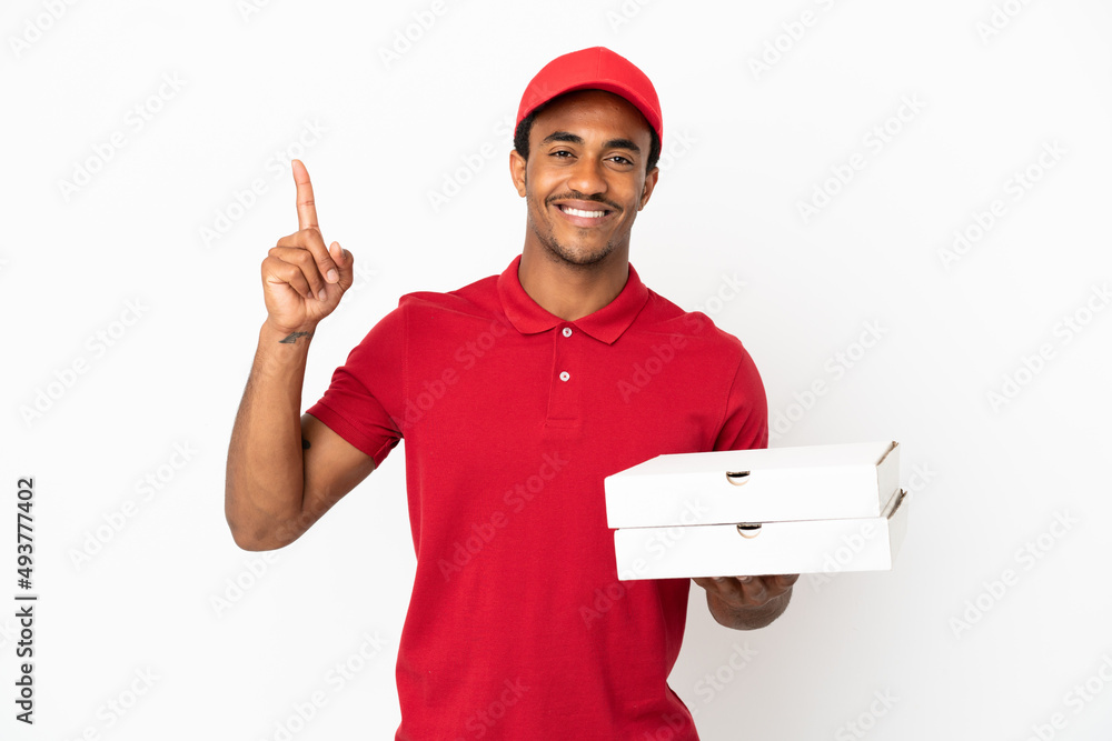 African American pizza delivery man picking up pizza boxes over isolated white wall pointing up a great idea African American pizza delivery man picking up pizza boxes over isolated white wall pointing up a great idea
