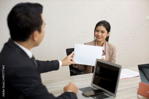 Collaborative process of professional businesspeople going over on new project, using paperwork and computer presentation with brainstorming ideas, coworker and work together at office meeting concept