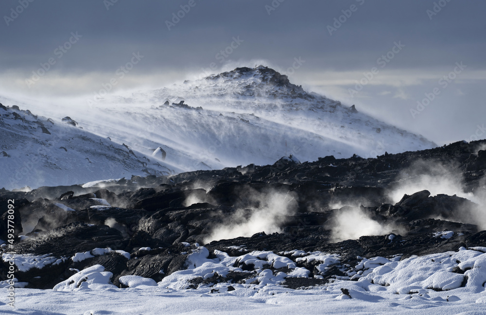 Lava field and snow blown by the wind in Iceland