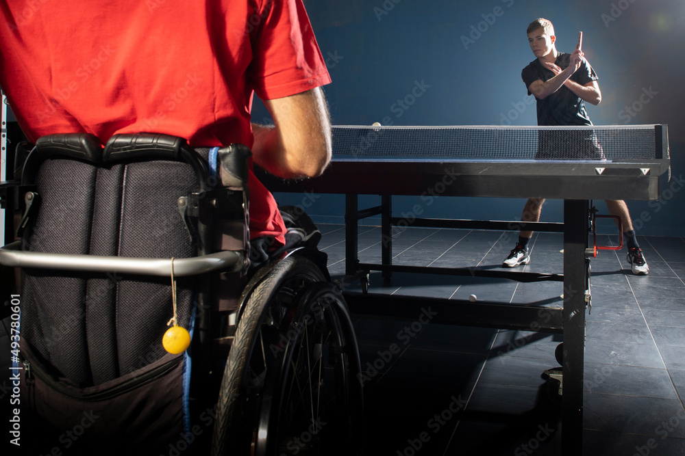 Fototapeta premium Wheelchair user playing table tennis