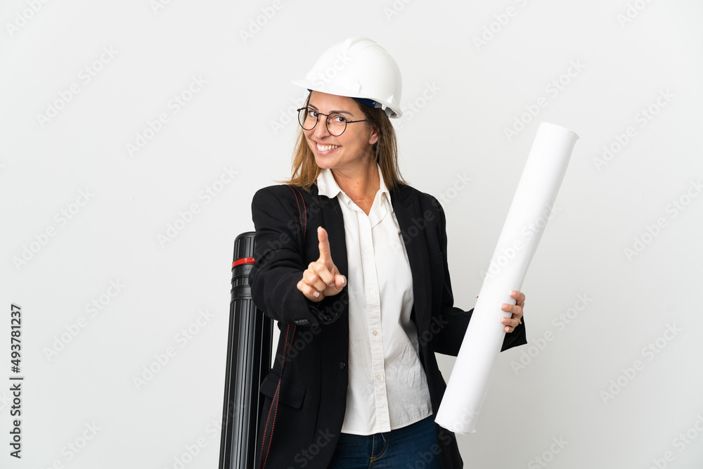 Middle age architect woman with helmet and holding blueprints over isolated background showing and lifting a finger Middle age architect woman with helmet and holding blueprints over isolated background showing and lifting a finger