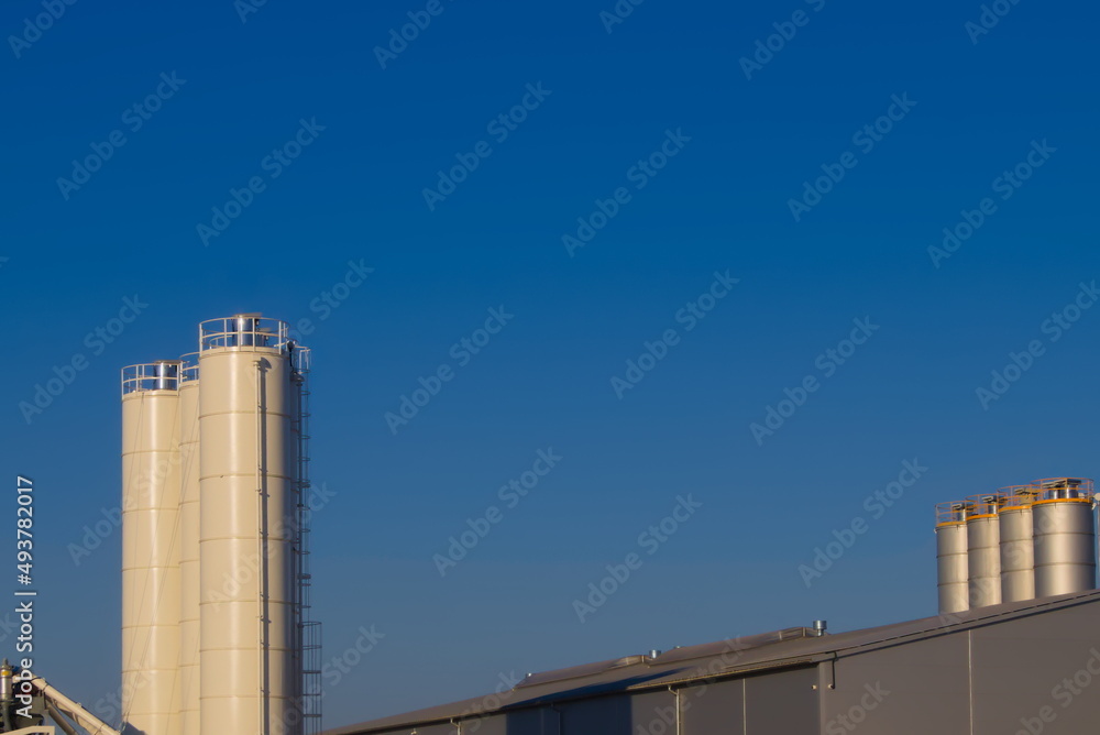 huge silos against the blue sky