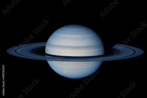 Saturn with rings, on a dark background. Elements of this image furnished by NASA