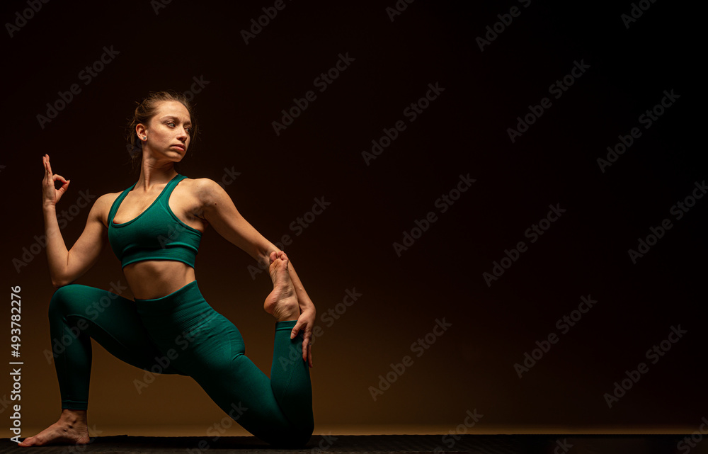 Doing some yoga pose on the ground while focsuing on the breathing Doing some yoga pose on the ground while focsuing on the breathing