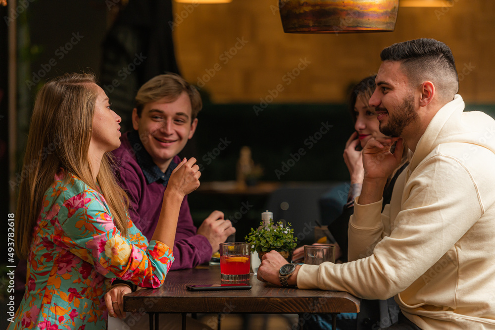 Having a discussion in the bar while having fun Having a discussion in the bar while having fun