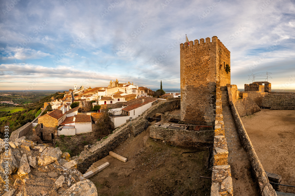 The medieval village of Monsaraz is a tourist attraction in the Alentejo, Portugal. From the walls of his castle we can contemplate an amazing panoramic view of the plains and the Alqueva Lake. The medieval village of Monsaraz is a tourist attraction in the Alentejo, Portugal. From the walls of his castle we can contemplate an amazing panoramic view of the plains and the Alqueva Lake.