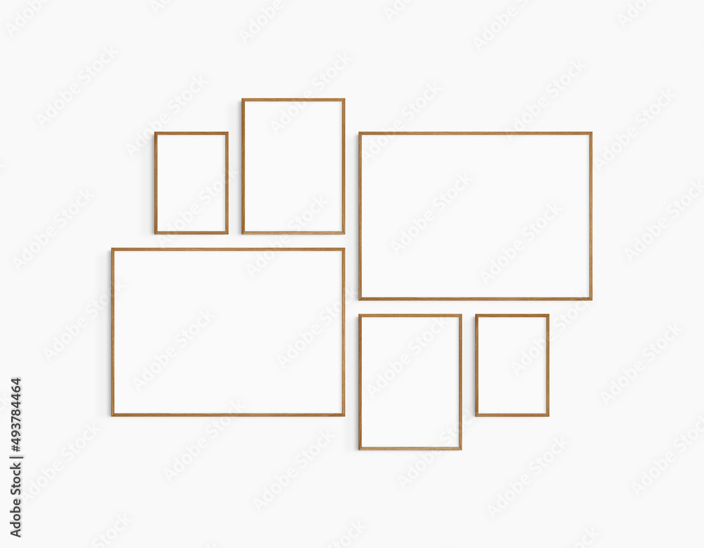 Gallery wall mockup. Set of 6 cherry wood frames. Gallery wall frame mockup. Two 70x50 (7:5), two 30x40 (3:4), and two A4 (5:7) wooden frames. Gallery wall mockup. Set of 6 cherry wood frames. Gallery wall frame mockup. Two 70x50 (7:5), two 30x40 (3:4), and two A4 (5:7) wooden frames.