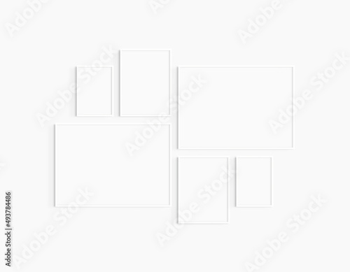 Gallery wall mockup. Set of 6 white frames. Gallery wall frame mockup. Two 70x50 (7:5), two 30x40 (3:4), and two A4 (5:7) white frames.
