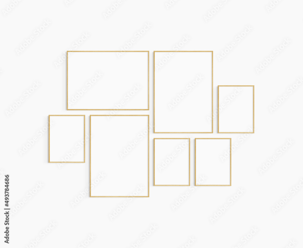 Gallery wall mockup. Set of 7 oak wood frames. Gallery wall frame mockup. Two 50x70 (5:7), one 70x50 (7:5), and four 30x40 (3:4) wooden frames. Gallery wall mockup. Set of 7 oak wood frames. Gallery wall frame mockup. Two 50x70 (5:7), one 70x50 (7:5), and four 30x40 (3:4) wooden frames.