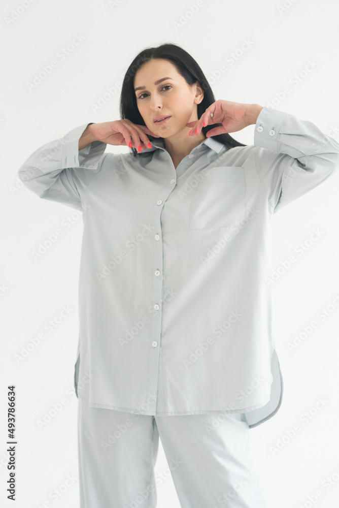 beautiful brunette adult girl in femine pajamas sleep wear homewear on white background beautiful brunette adult girl in femine pajamas sleep wear homewear on white background