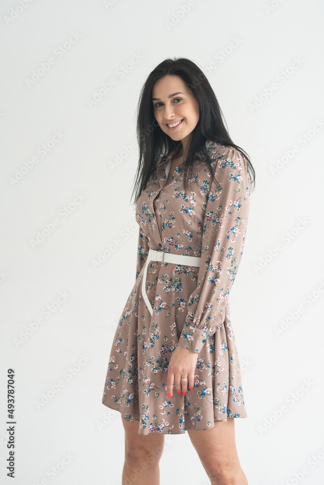 adult young woman is resting in a beautiful feminine blue dress in a bright room by the window relax rest break anticipation anticipation adult young woman is resting in a beautiful feminine blue dress in a bright room by the window relax rest break anticipation anticipation