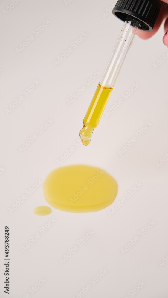 beautiful flat lay skin care yellow serum liquid oil dropper white background beautiful flat lay skin care yellow serum liquid oil dropper white background