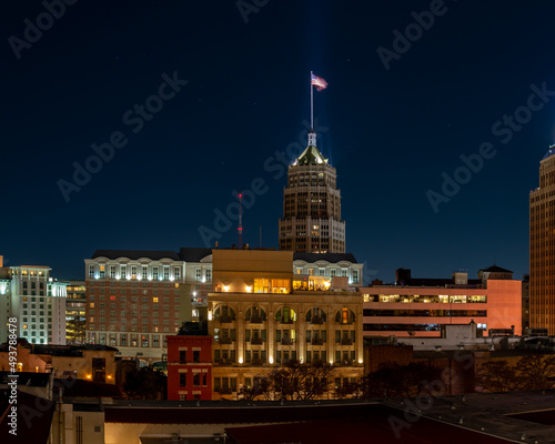 View of American Flag Lit Up on Top of Buiding in Downtown San Antonio, TExas