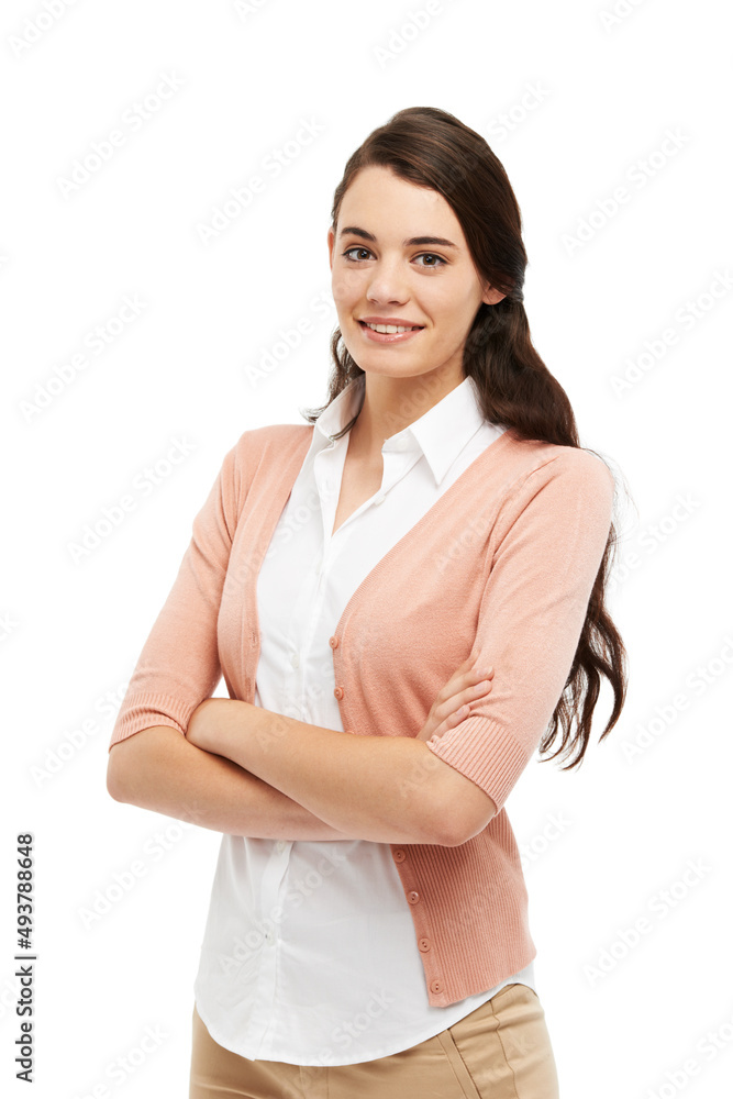 Calm and composed. Cropped view of a preppy young woman standing against a white background with her arms folded. Calm and composed. Cropped view of a preppy young woman standing against a white background with her arms folded.