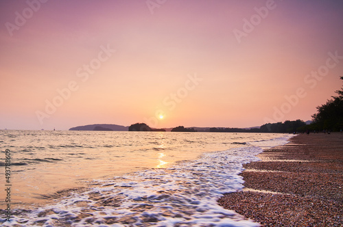 Beautiful landscape with pinkl sunset on the tropical seashore. photo