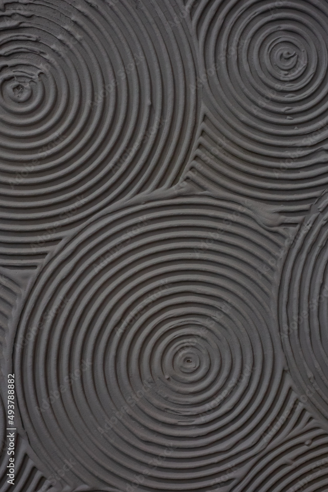 Concrete surface with circular pattern made of grey cement Concrete surface with circular pattern made of grey cement