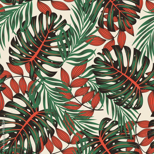Abstract seamless tropical pattern with bright plants and leaves on a beige background. Trendy summer Hawaii print. Modern abstract design for fabric, paper, interior decor.