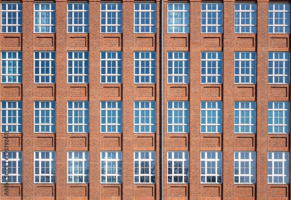 Facade from an tall old brick building 