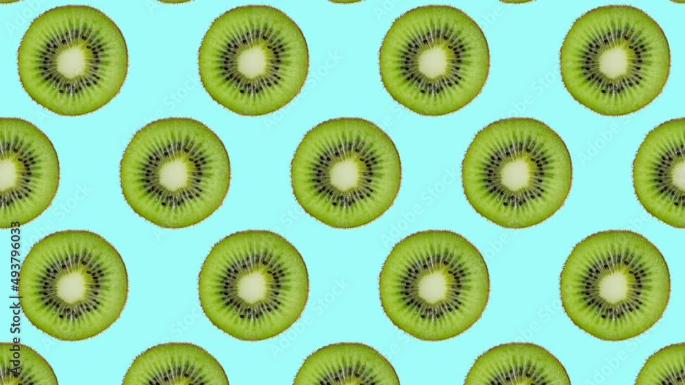 Minimal motion design - Kiwi slices rotating and moving down at cyan color background. Trendy colors and style graphics. Seamless looping animation. Minimal motion design - Kiwi slices rotating and moving down at cyan color background. Trendy colors and style graphics. Seamless looping animation.