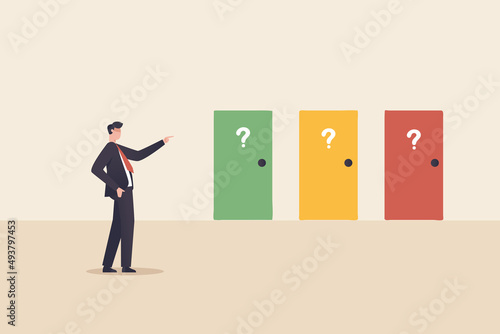 making decision, success or failure concept. Businessman standing in front of many colourful doors trying to choose one looking at way to unknown future and opportunity.