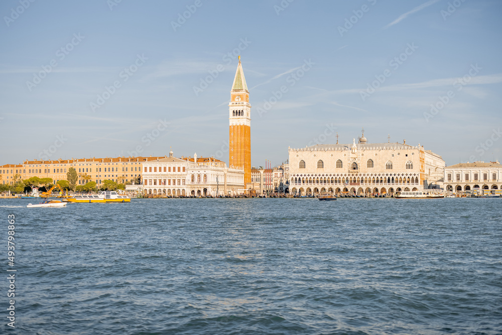 Landscape view from the sea on Saint Mark's basilica and bell tower in Venice. Autumn sunny day. Concept of famous italian landmarks and tourist attraction