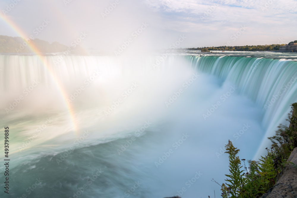 Long exposure of Horseshoe Falls on a sunny autumn day. Niagara Falls, Canada.