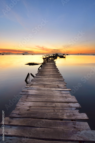 Fototapeta Naklejka Na Ścianę i Meble -  Sunrise scenery of a wooden jetty 