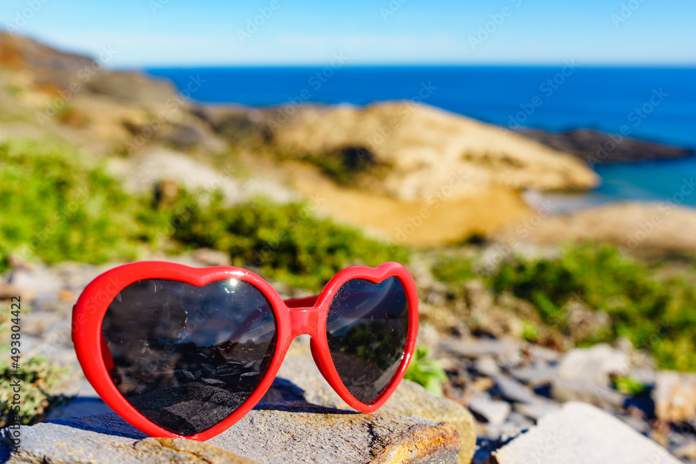 Sunglasses against sea coast