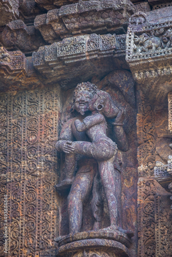 Erotic statues of couples making love in the 800 year old Sun Temple Complex, Konark, India. Kamasutra postures in Hindu Indian Temples. UNESCO World Heritage Site.
